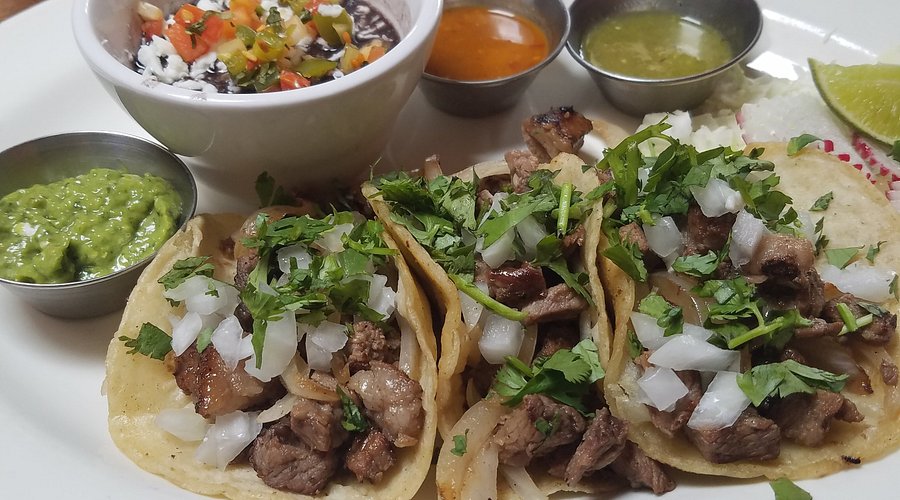 El Callejon Taqueria and Grill signature dishes Tacos al PastorLechon TacosAdovada